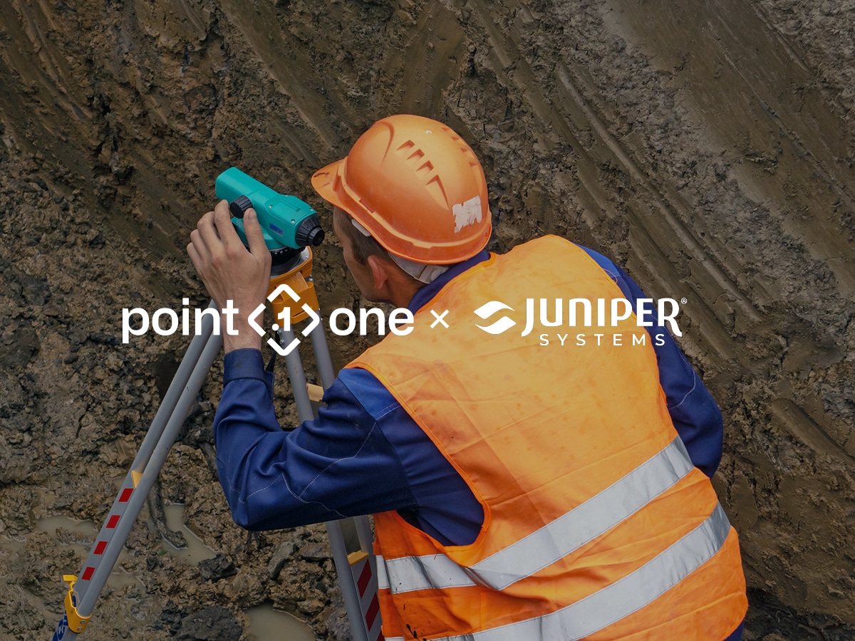 A construction worker in an orange vest and helmet uses RTK hardware surveying equipment in a muddy trench. Logos for Point One and Juniper Systems are overlaid on the image.