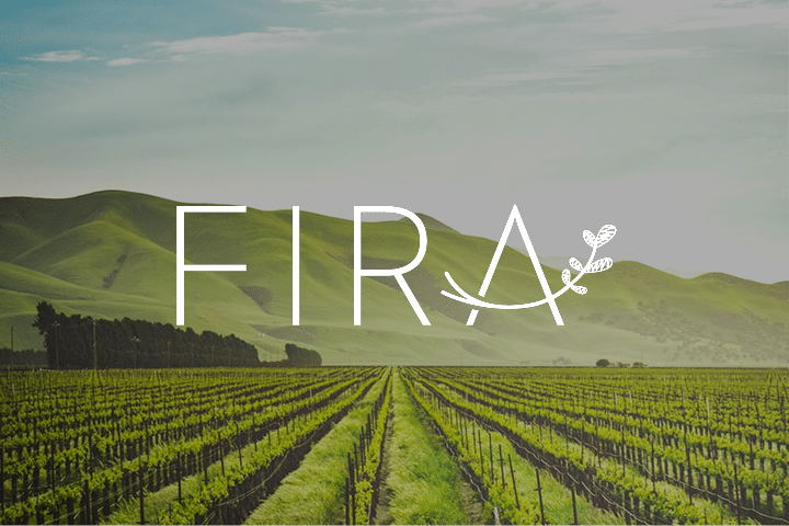 Rows of grapevines stretch into the distance beneath green hills and a cloudy sky, setting the scene for unforgettable events. Large white text reading FIRA with a leaf design is superimposed over the image.