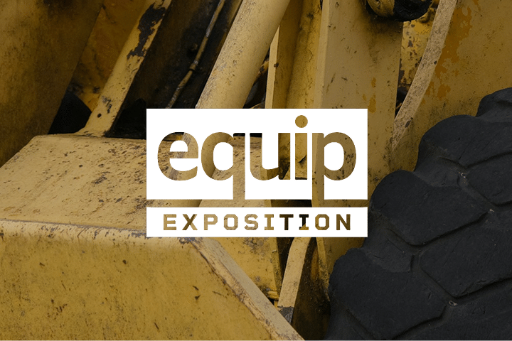 Close-up of yellow construction equipment with the words equip EXPOSITION in bold white text overlaid in the center.