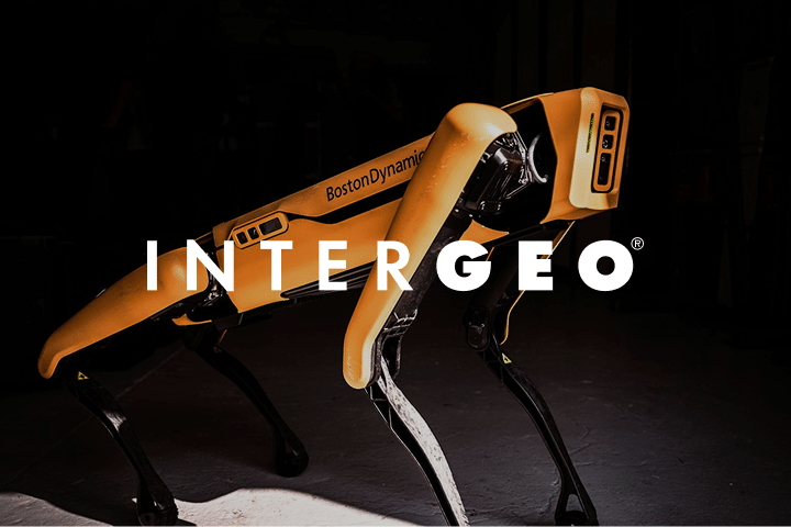 A yellow Boston Dynamics robot dog stands on a dark background with the word INTERGEO in bold white letters overlaid across the image.