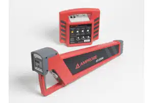Two red and black electronic devices labeled Amprobe AT-3500, designed for cable and pipe location, are shown on a white background. One is rectangular with control switches; the other is a long, handheld locator.